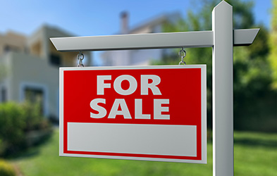 Red and White FOR SALE sign outside one of many homes for sale in Middletown NJ