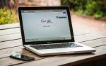Laptop on wood table outside with search engine website open; Ocean County SEO is important